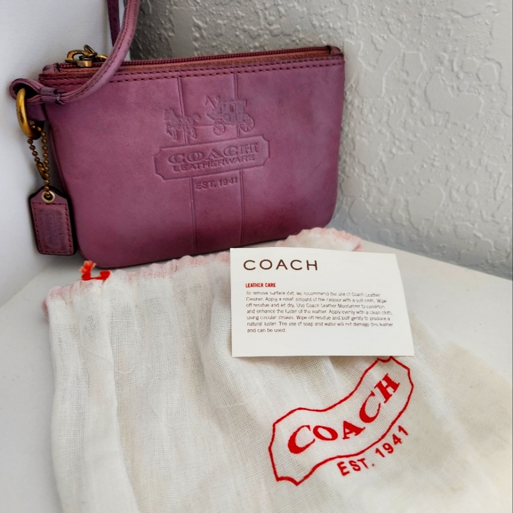 Small leather lavender colored Coach Wrislet